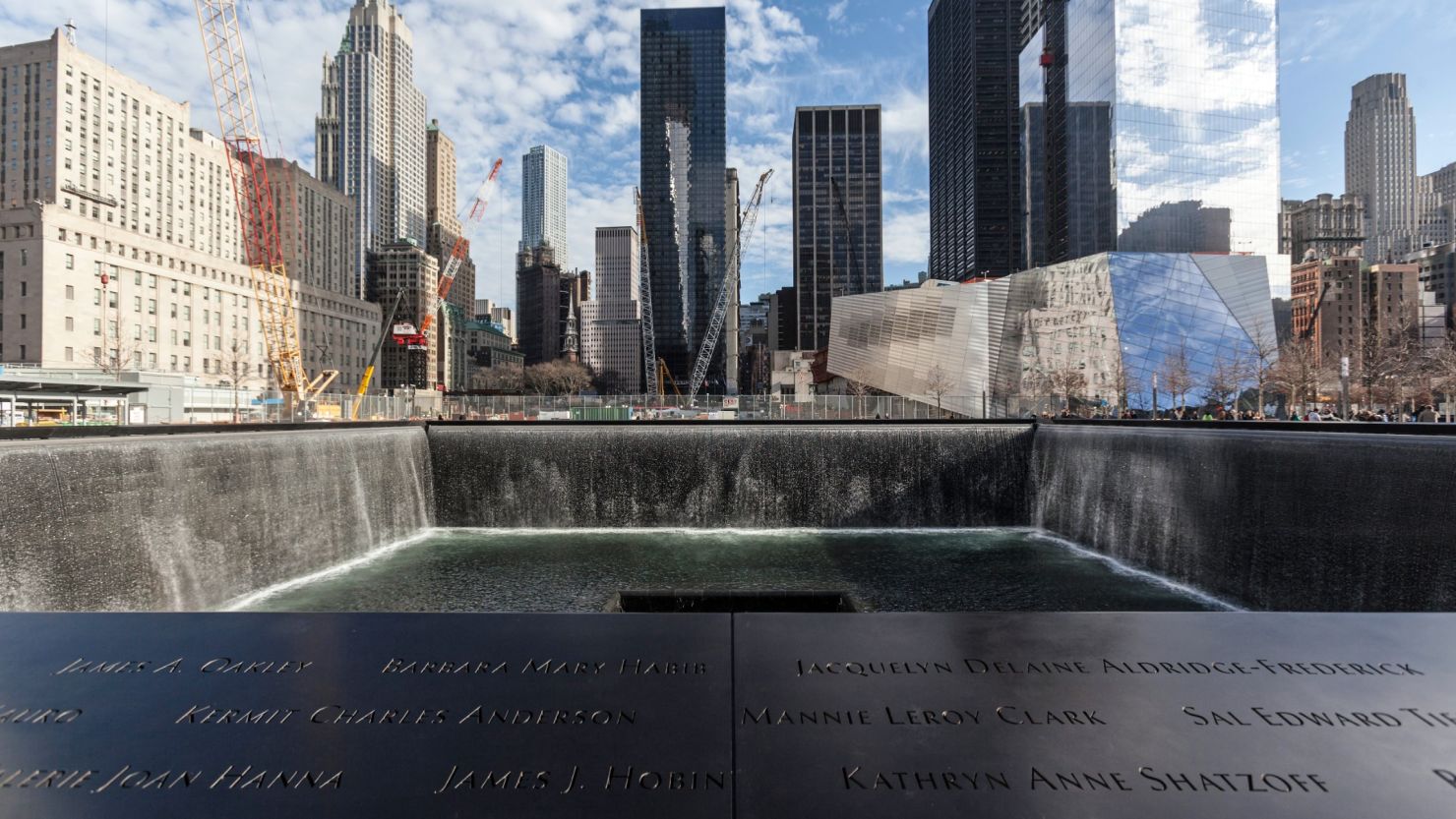 Twin reflecting pools at the 9/11 Memorial mark the footprints of the original World Trade Center towers.