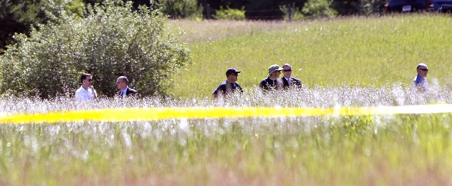 FBI agents search a field for Hoffa's remains on Monday, June 17, 2013, in Oakland Township, Michigan, outside Detroit. Alleged mobster Tony Zerilli tipped off the police, and a source close to the case said the information provided was "highly credible."