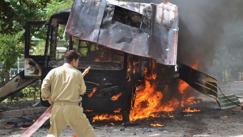 Pakistani fire fighters extinguish a burning university bus after a bomb blast in Quetta, the capital of Baluchistan province, on June 15, 2013. At least 23 people were killed after militants blew up a bus carrying female students in Pakistan's troubled southwest and later targeted the hospital treating survivors, as a gun battle with insurgents continued, officials said. AFP PHOTO/ Banaras KHANBANARAS KHAN/AFP/Getty Images
