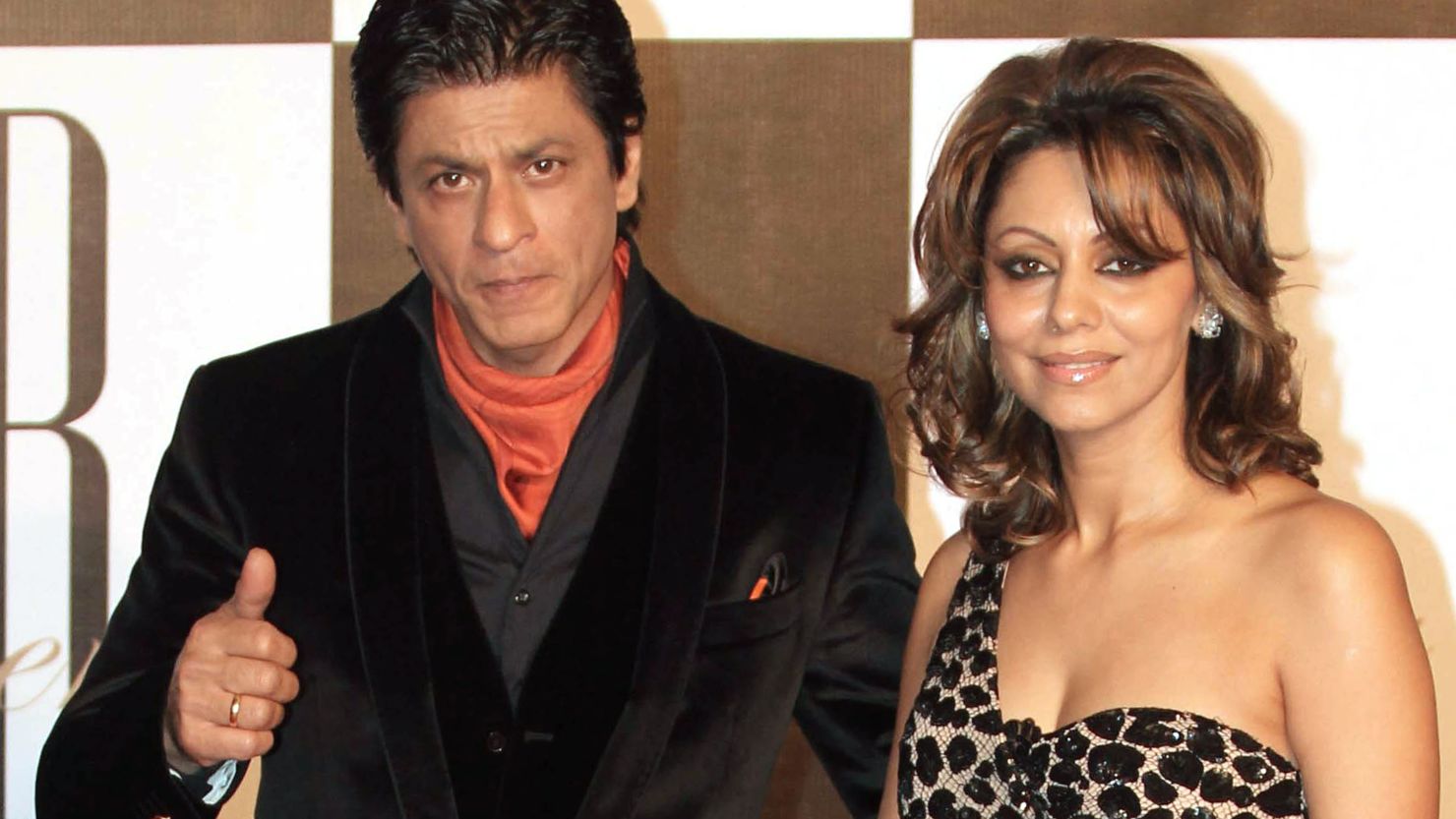 Indian Bollywood actor Shah Rukh Khan (left) poses with his wife Gauri.