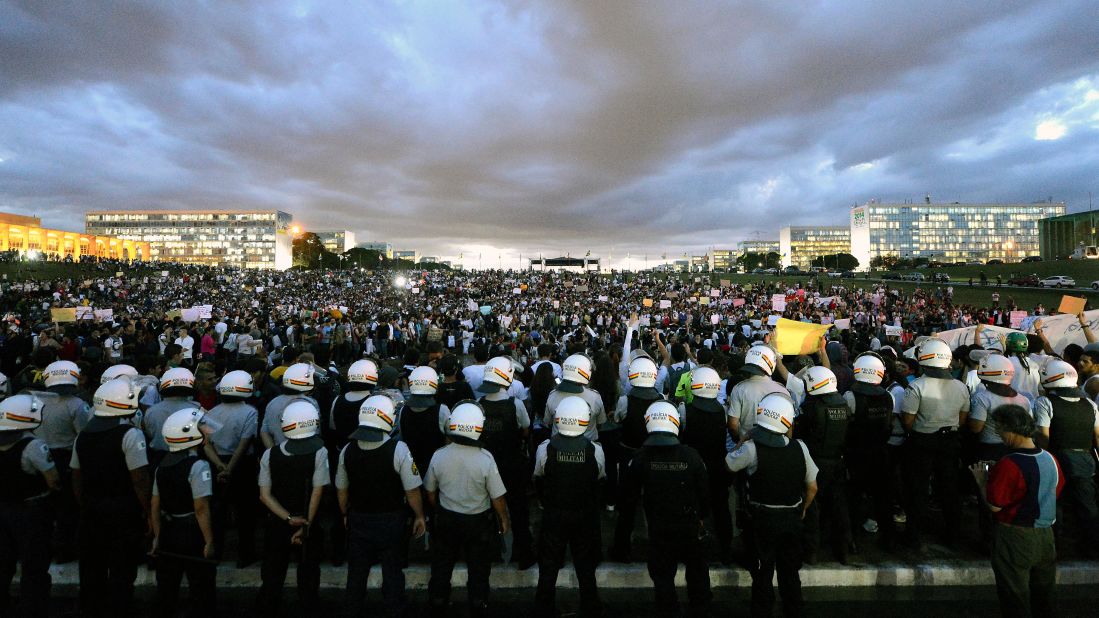 Thousands stand in the gardens of the National Congress in Brasilia during a protest on June 17.
