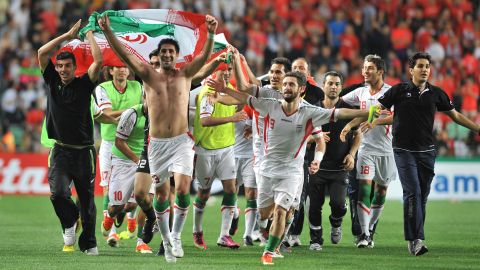 Iran's players celebrate after beating South Korea 1-0 to reach the 2014 World Cup.