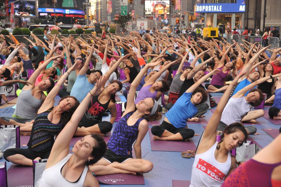 If summer solstice celebrations sound too stressful, there is always the option to join the 'Solstice in Times Square' event in New York City, where thousands of people practice yoga together. "Yoga has always been associated with the sun as a life-giving and healing force," says Asterio Tecson, who took these photos in 2012. 