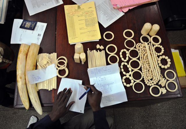 A police officer catalogs illegal ivory found in the possession of four Chinese men in Nairobi, Kenya, in January, 2013. The men pleaded guilty to smuggling thousands of dollars worth of ivory and were fined just $340 each. The loot included 40 chopsticks, six necklaces, bracelets and a pen holder, as well as raw ivory that had a black market value of $24,000 in Asia. 