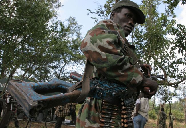 A member of the Lord's Resistance Army stands guard. The group is accused of poaching elephants in the Democratic Republic of Congo's Garamba National Park and using the profits to fund terror activities.