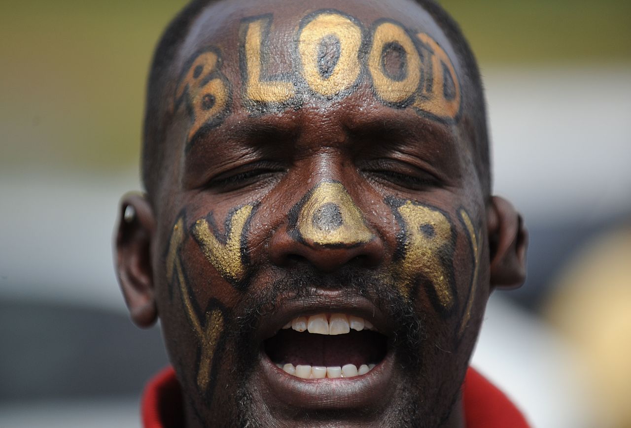 A man with the words "Blood Ivory" painted on his face protests in Nairobi with a group called Kenyans United Against Poaching.