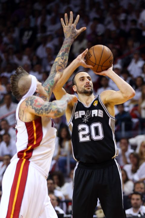 Manu Ginobili of the San Antonio Spurs shoots over Chris Andersen of the Miami Heat.