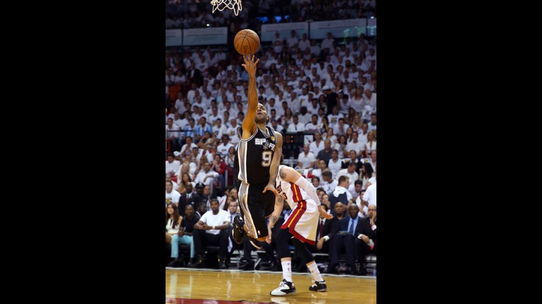 Tony Parker of the San Antonio Spurs goes up for a shot against Mike Miller of the Miami Heat in the first quarter.
