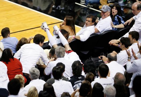 Chris Andersen of the Miami Heat dives into the seats chasing a ball in the second quarter against the San Antonio Spurs.