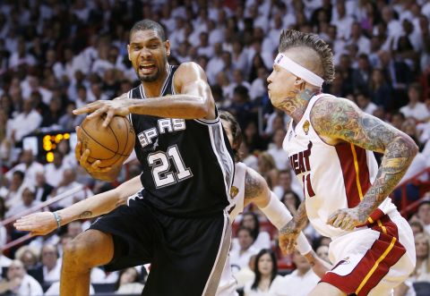 The San Antonio Spurs' Tim Duncan drives to the net on Miami Heat's Chris Andersen during Game 6.