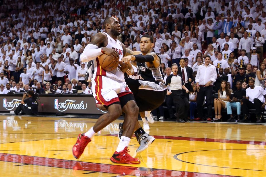 LeBron James of the Miami Heat goes up for a shot against Danny Green of the San Antonio Spurs in overtime during Game 6.