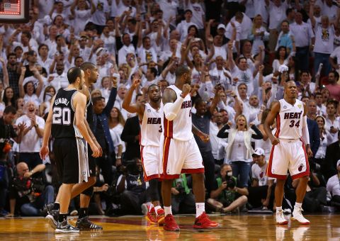 Dwyane Wade, back, LeBron James, center, and Ray Allen of the Miami Heat celebrate after defeating the San Antonio Spurs during Game 6 of the 2013 NBA Finals on Tuesday, June 18, in Miami. The Heat beat the Spurs 103-100 to tie the series 3-3. <a href="http://www.cnn.com/2013/06/16/us/gallery/nba-finals-game-5/index.html">See photos from Game 5.</a>