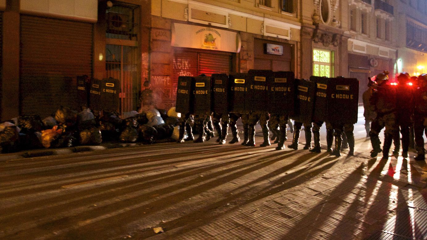 Riot police take positions during a protest in Sao Paulo on Tuesday, June 18.