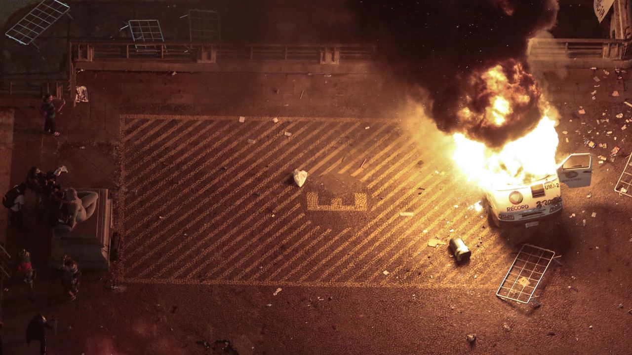A press car burns in front of Sao Paulo City Hall on June 18.