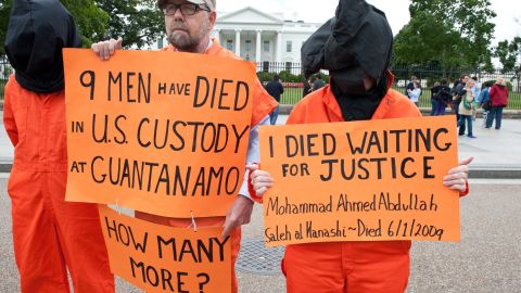 Protresters demanding the closing of the Guantanamo detention facility and the end of the ongoing hunger strike by 103 of the inmates stand outside the White House in Washington on May 24, 2013. 