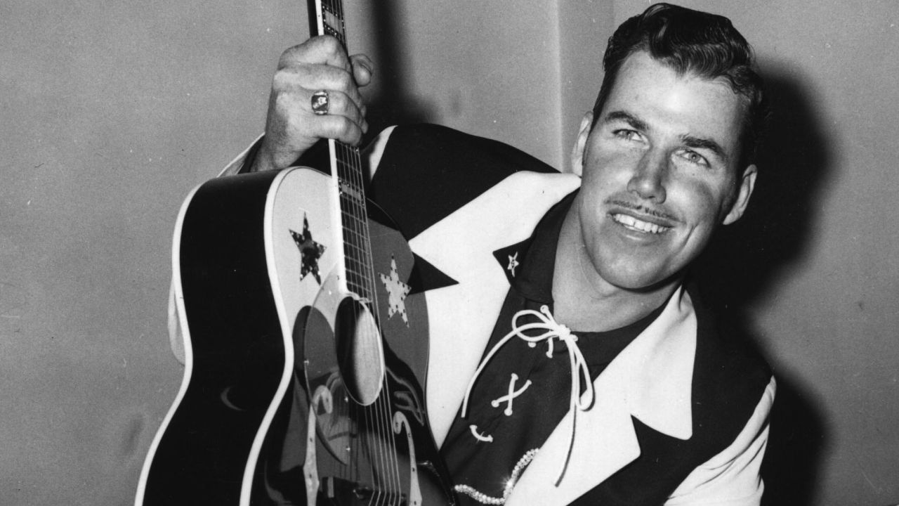 Country music singer/songwriter Slim Whitman died on June 19, his son-in-law Roy Beagle told CNN. He was 90. Above, Whitman poses with his guitar at a press conference at the Prince of Wales Theatre in London, on February 22, 1956.