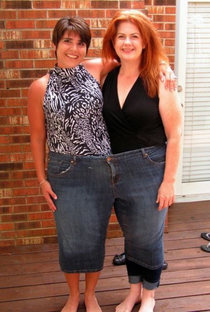 Ritchie, left, and Moyer try on a pair of Moyer's "before" jeans -- size 28 -- on Father's Day. The two friends have lost more than 280 pounds together in 2½ years.
