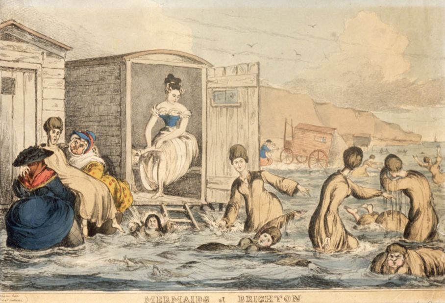In 1825, women wore "bathing dresses" at the beach. This illustration shows women of the era venturing into the ocean via bathing machines -- sort of a dressing room on wheels -- that brought them directly to the water.