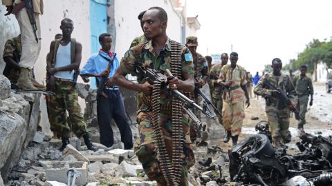 Somali soldiers patrol after al Qaeda-linked insurgents shoot their way into the U.N. compound in Mogadishu on June 19.