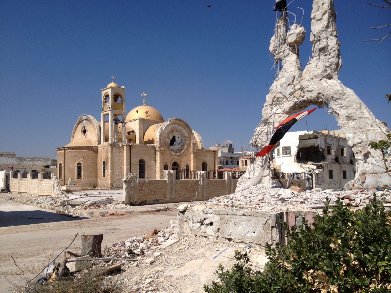 The city's only church was badly damaged by the fighting. Some of the icons and paintings inside were also defaced -- the Syrian army blames Islamist rebels.