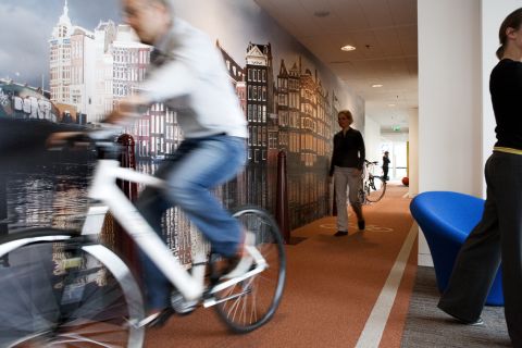Activity plays a key role at Google, such as this indoor bike line at its Dutch HQ.