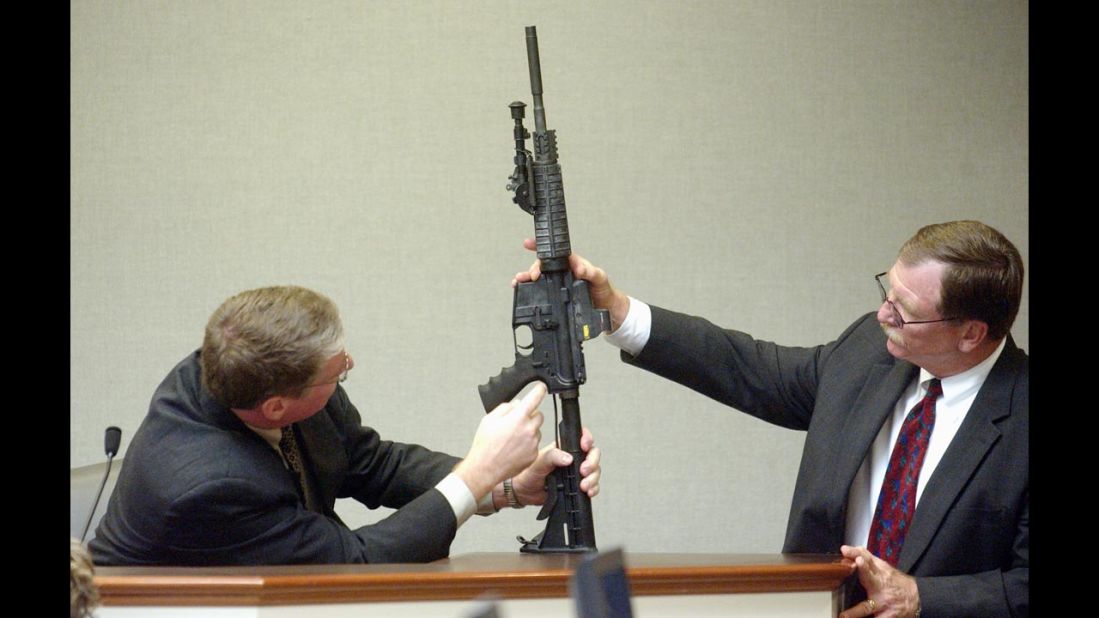 During court proceedings in November 2003, Timothy Curtis points out features on a Bushmaster rifle said to have been used by Muhammad.