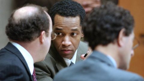Muhammad talks with attorneys Peter Greenspun, left, and Jonathan Shapiro, right, during his trial in Virginia Beach on October 21, 2003.