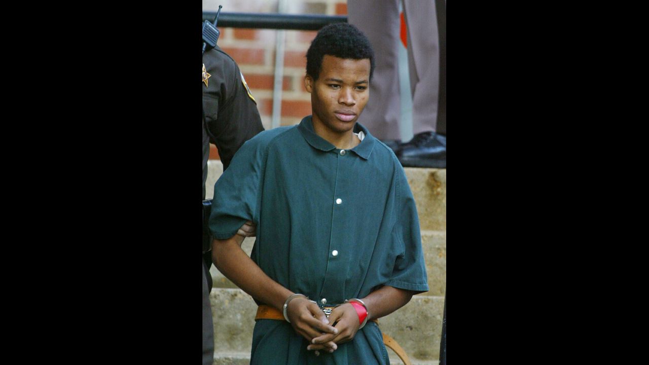 Malvo, 17, walks out of Fairfax County, Virginia, Juvenile Court on November 19, 2002.