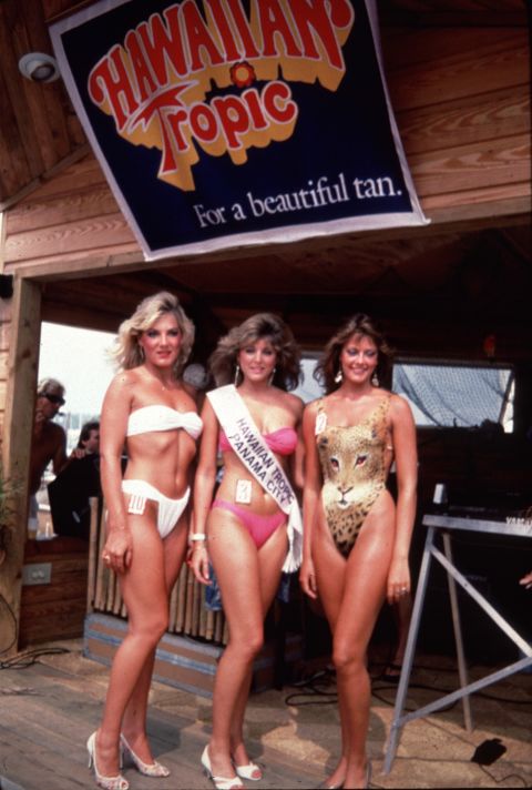The Hawaiian Tropic bikini pageants of the 1980s featured models in skimpy, high-cut bikinis and swimsuits, which showed off the sun-worshiping, tanning culture of the time. Marla Maples, pictured here in the center, was a Hawaiian Tropic beauty queen before becoming Mrs. Donald Trump.