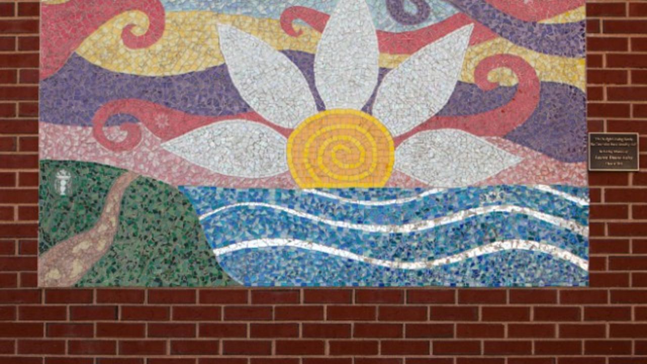 A mosaic in memory of Lauren Astley hangs at her alma mater, Wayland High School.