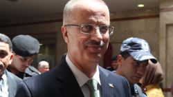 Newly appointed Palestinian prime minister, head of Al-Najah University Rami Hamdallah, visits the West Bank city of Nablus on June 4, 2013. Hamdallah, said he would strive to continue the work of his predecessor and that he was ready to stand aside for a Fatah-Hamas unity government. A day after being hand-picked by Palestinian president Mahmud Abbas, Hamdallah's appointment was hailed by the United States. Israeli observers also welcomed the arrival of someone they described as a moderate pragmatist. AFP PHOTO/JAAFAR ASHTIYEH (Photo credit should read JAAFAR ASHTIYEH/AFP/Getty Images)
