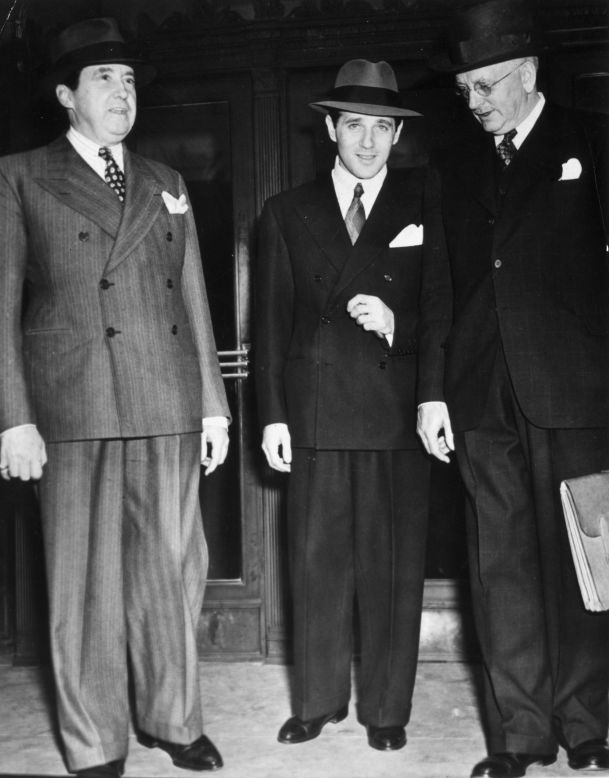 Benjamin "Bugsy" Siegel, at center with two unidentified men, established crime syndicate-controlled gambling in Las Vegas.