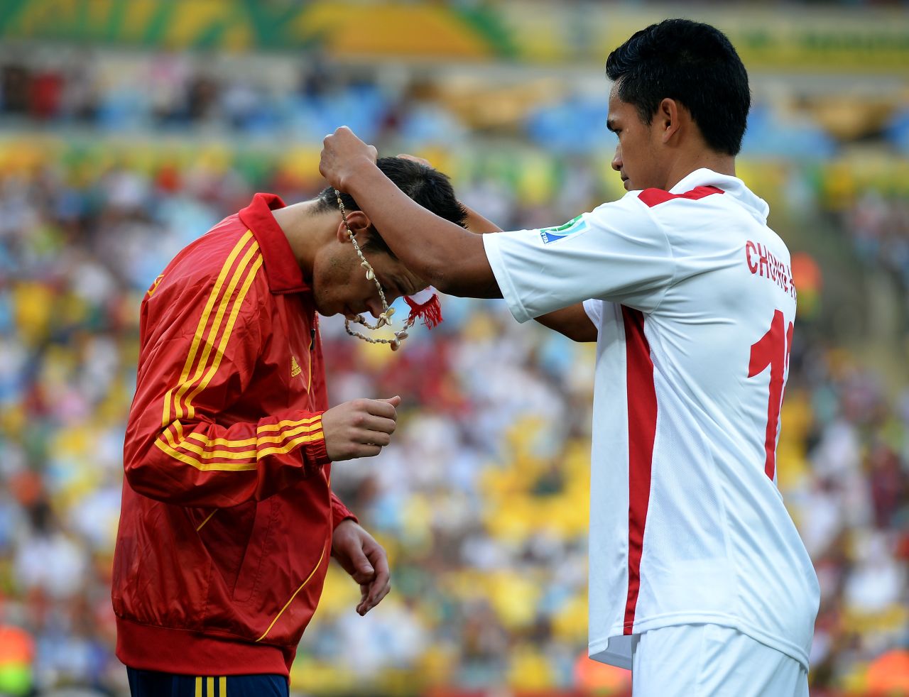 Before the game Tahiti's players presented each man in the Spanish squad with a necklace. Here, Steevy Chong Hue puts one round the neck of Cesar Azpilicueta.