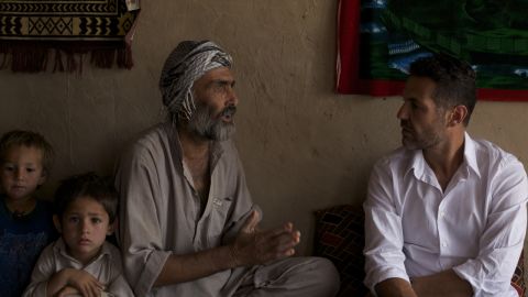 Writer Khaled Hosseini, right, visits Afghanistan as a goodwill envoy for the U.N. Refugee Agency.