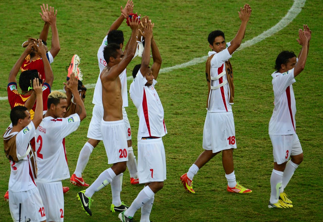 Tahiti's players lap up the acclaim from the stands at the end of the match.