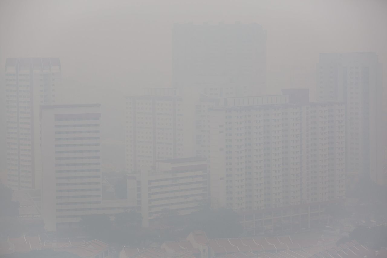 Apartment buildings were shrouded in a haze of smoke on Wednesday, June 19, in Singapore.  The city-state's worst pollution crisis in more than a decade, the haze stems from illegal slash-and-burn forest fires in neighbouring Sumatra, Indonesia.