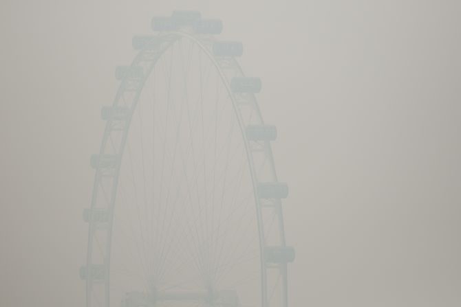 The Singapore Flyer ferris wheel was barely visible through the smoke haze on June 20.  That day, the country's Pollutant Standards Index (PSI) rose to the highest level on record, reaching 371.
