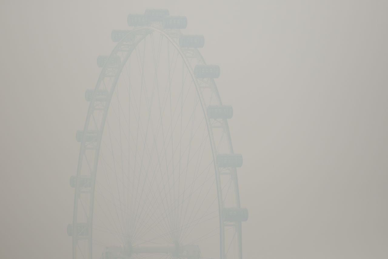 The Singapore Flyer ferris wheel was barely visible through the smoke haze on June 20.  That day, the country's Pollutant Standards Index (PSI) rose to the highest level on record, reaching 371.