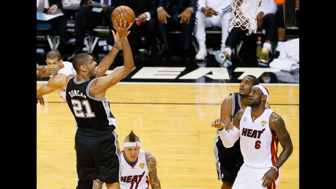 Tim Duncan of the San Antonio Spurs shoots over LeBron James of the Miami Heat. 