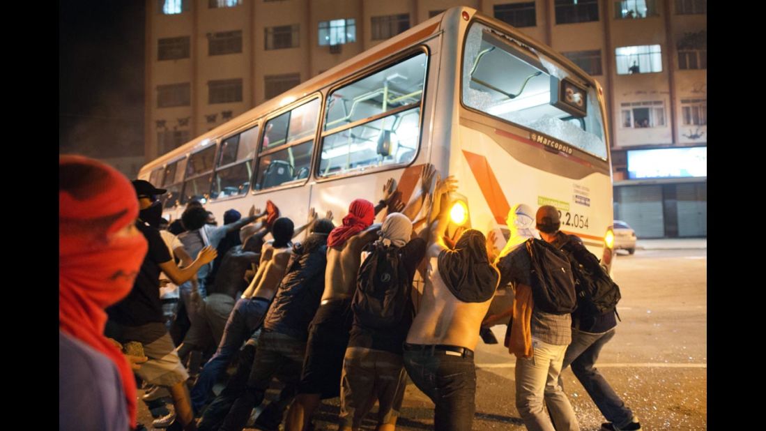 Protesters overturn a bus in Niteroi on June 19.