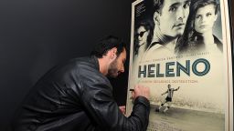 Actor Rodrigo Santoro signs a poster for the film "Heleno", in which he plays the mercurial striker. A destructive personality, together with illness and drug problems prevented Heleno from becoming one of Brazil's greatest ever players. But he helped pave the way for some of the world's greatest soccer icons...