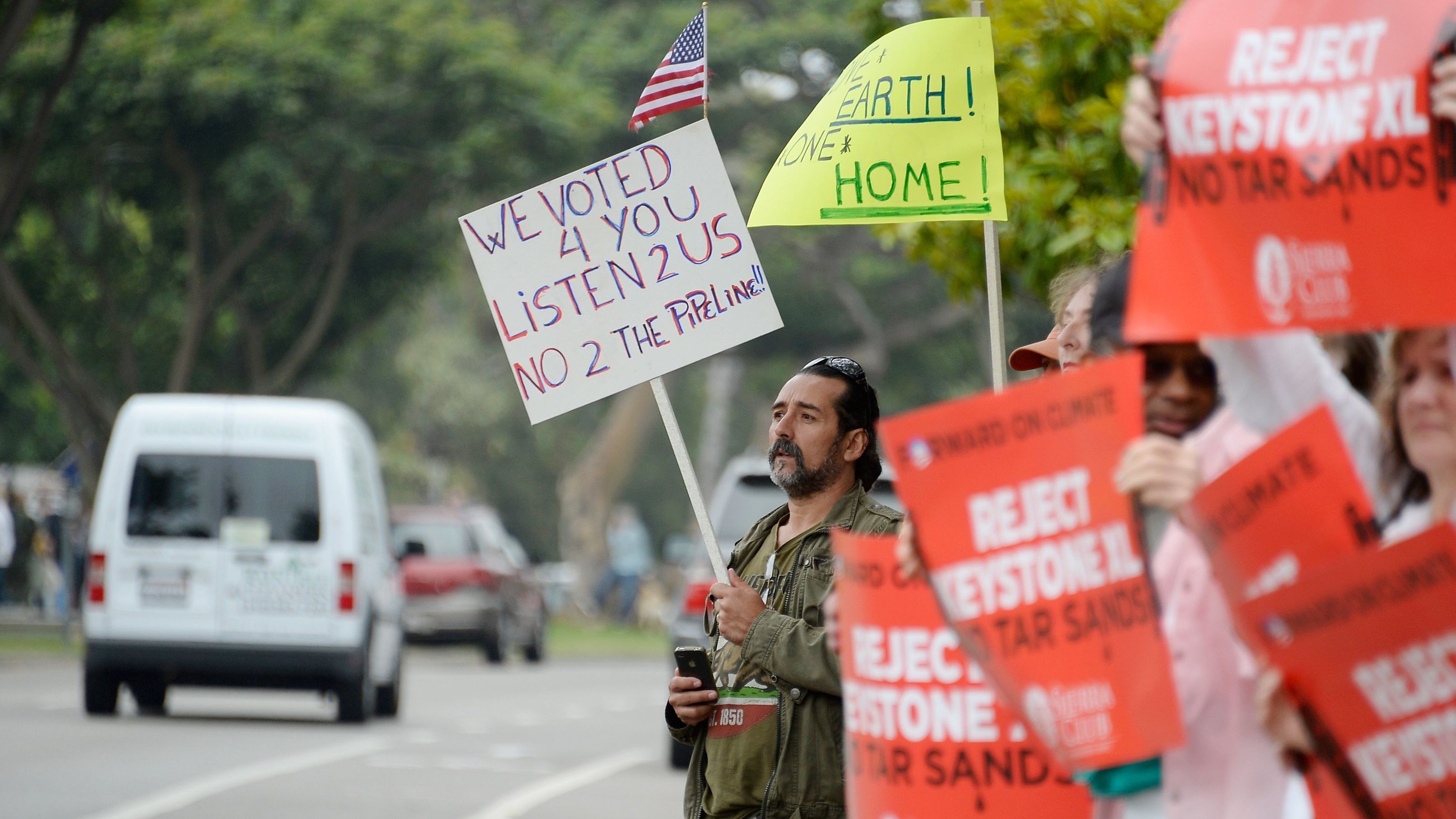Protesters send a message to the president over the Keystone XL pipeline at a Santa Monica, California, fund-raiser this month.