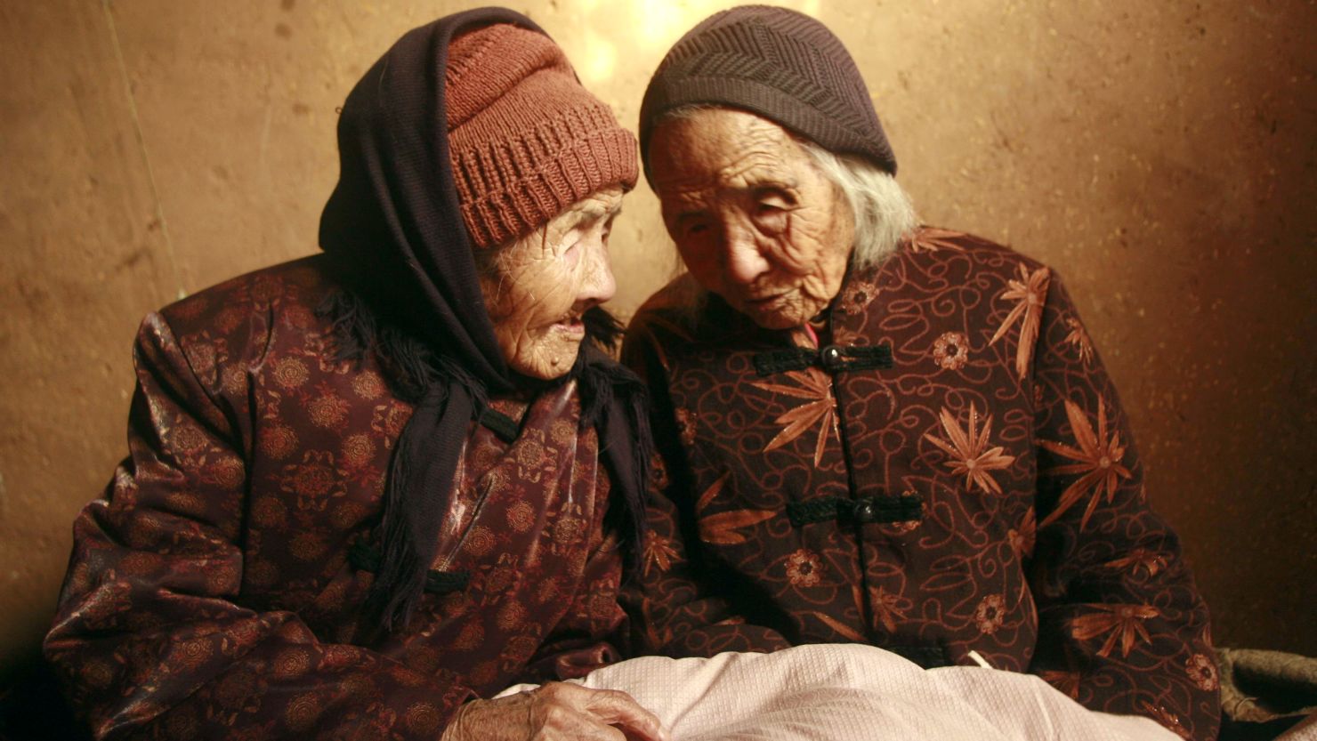 Chinese twins Cao Xiaoqiao, left, and Cao Daqiao were 104 when this photo was taken in 2009. 