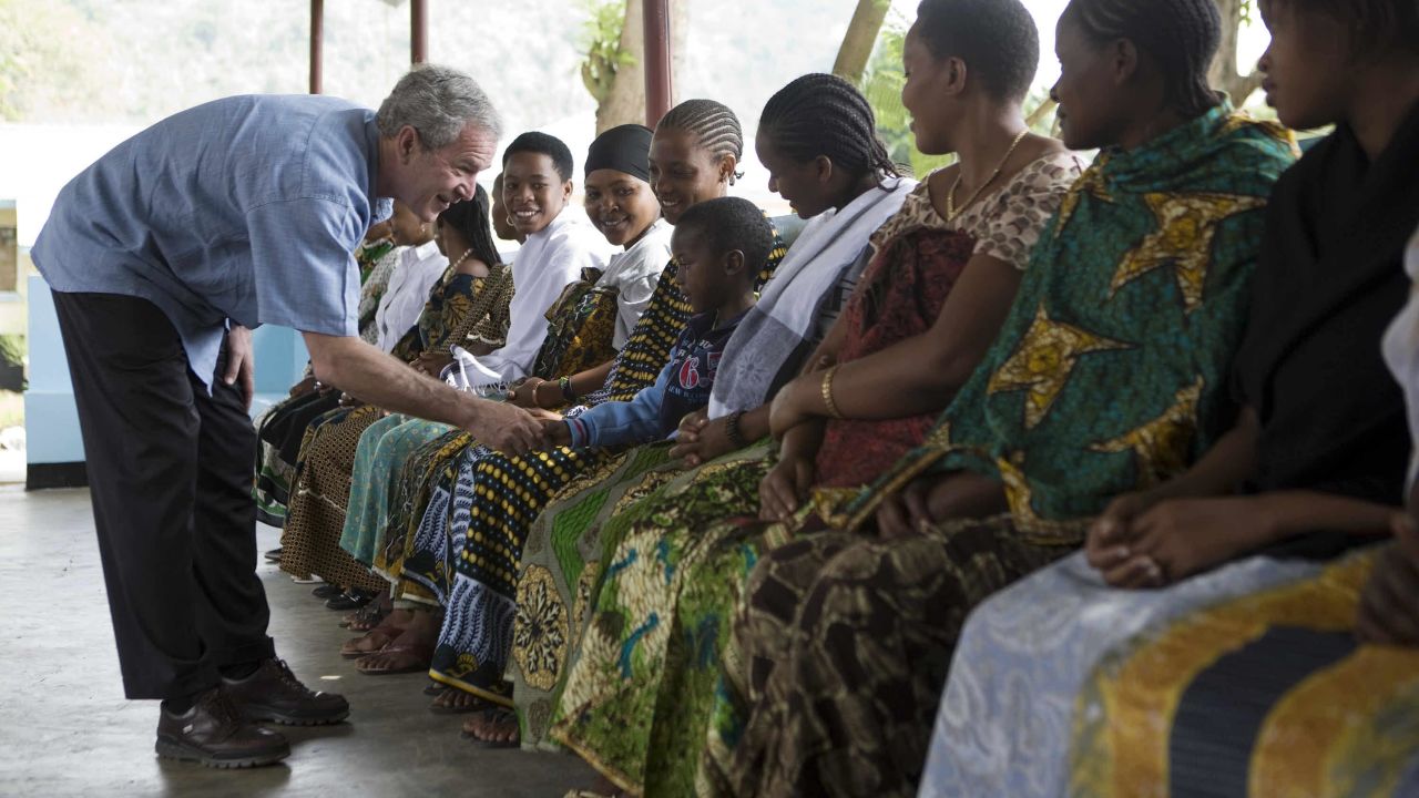 President George W. Bush meets women and children at the reproduction and child health unit of Meru District Hospital in Arusha, Tanzania, on February 18, 2008.