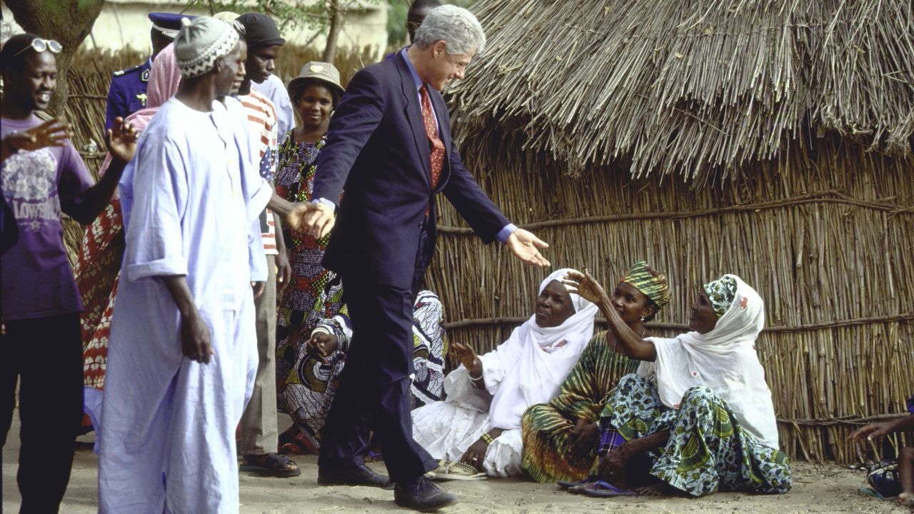 President Clinton greets people during a tour of a village in Senegal on April 1, 1998.