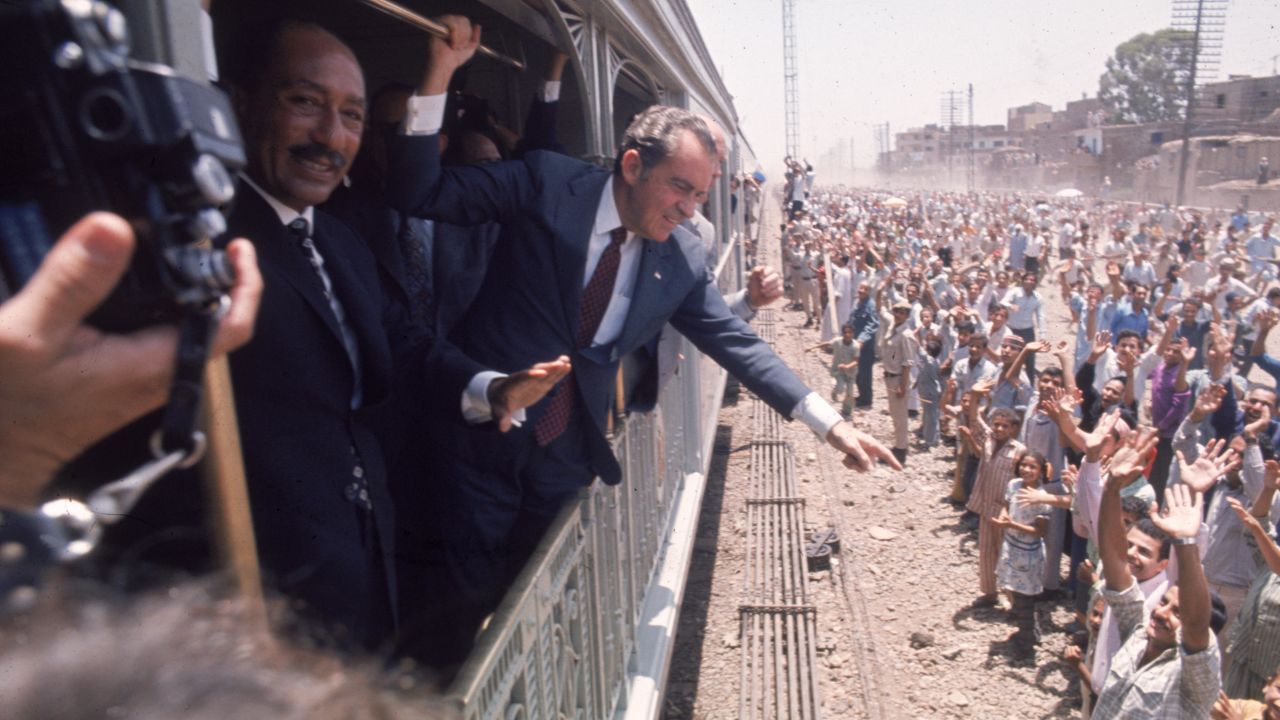 President Richard Nixon and Egyptian President Anwar Sadat greet people in Egypt, in June 1974.