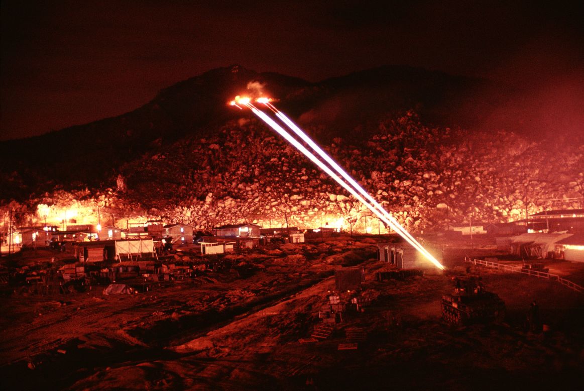 Hensinger used a long exposure to capture the firefight, resulting in dramatic images of the path of tracer and heavy artillery fire. 