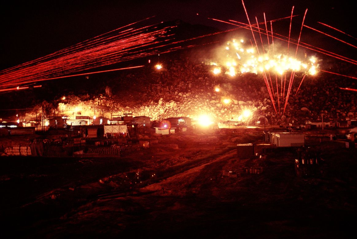 The red lines in the photos are tracer fire from M60 and M2 machine guns. The white areas were created by Browning Machine Guns firing in long bursts.  
