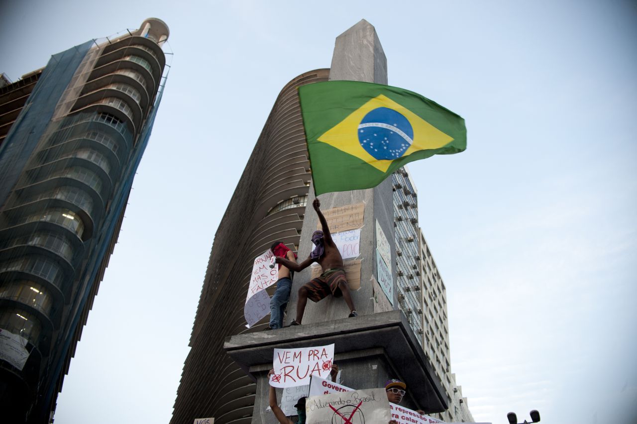 A demonstrator waves the Brazilian flag during the 2013 protests in Belo Horizonte, where thousands marched.<br /><br /> 