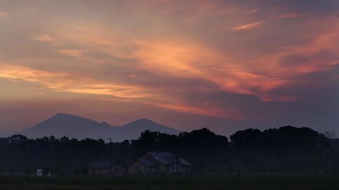 Smoke fills the sky as dawn breaks near South Fork, Colorado, on Saturday, June 22.